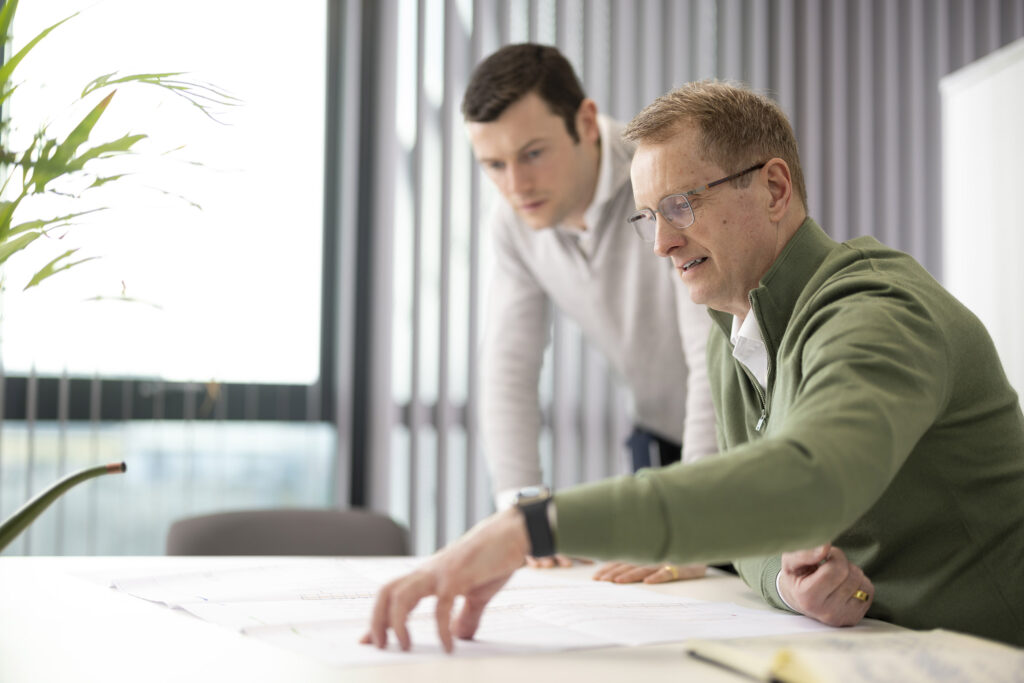 Digital Marketing Services 1 Two men at a table discussing marketing plans