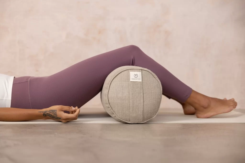 Legs hanging over a Yogamatters bolster